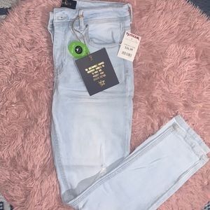 Light blue ripped jeans